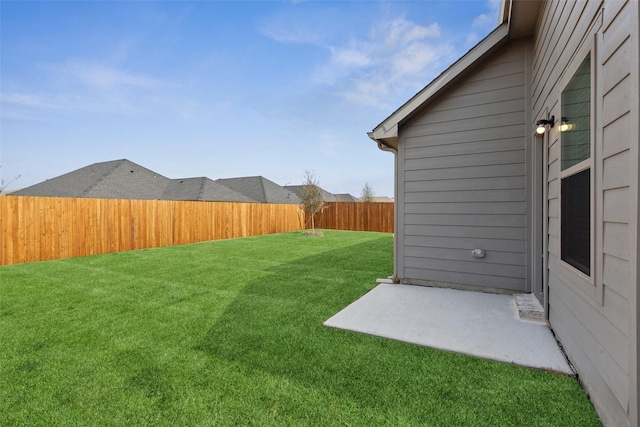 view of yard with a fenced backyard