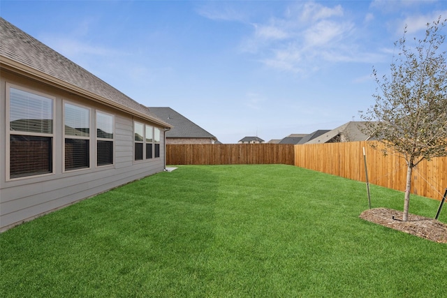 view of yard with a fenced backyard