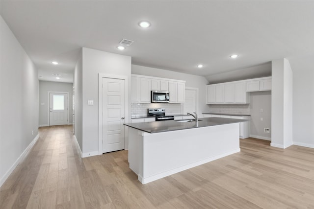 kitchen with white cabinetry, visible vents, appliances with stainless steel finishes, and a sink