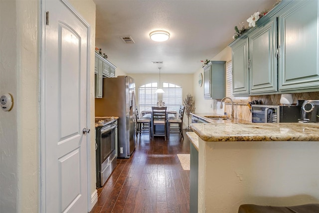 kitchen featuring visible vents, stainless steel electric range oven, light stone counters, dark wood-style floors, and a sink