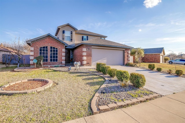 traditional-style home featuring stucco siding, a front lawn, concrete driveway, an attached garage, and brick siding