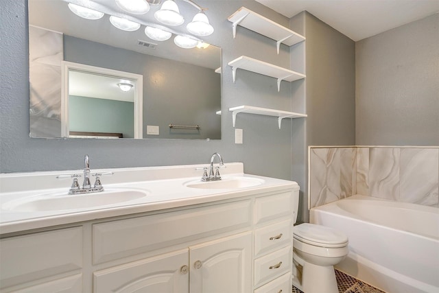 bathroom featuring a sink, visible vents, a tub to relax in, and double vanity