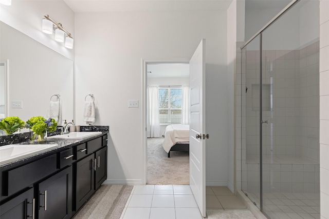 full bath with a sink, ensuite bath, a stall shower, and tile patterned flooring