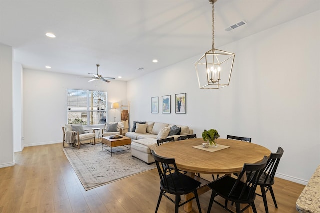 dining space with recessed lighting, visible vents, baseboards, and light wood finished floors