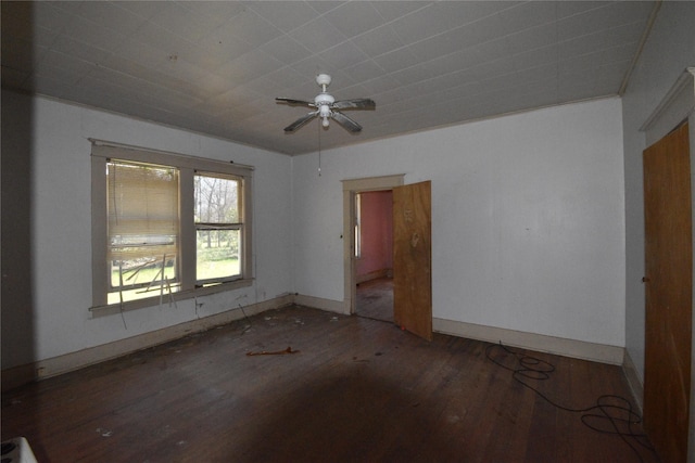 unfurnished room with baseboards, wood-type flooring, and ceiling fan