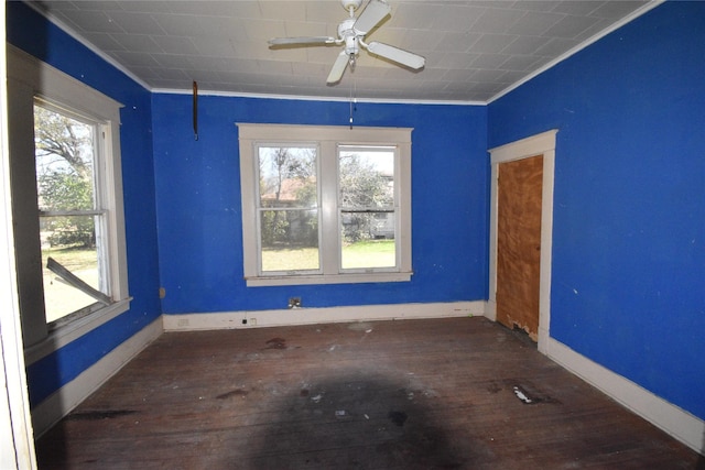 empty room with ceiling fan, baseboards, and hardwood / wood-style flooring