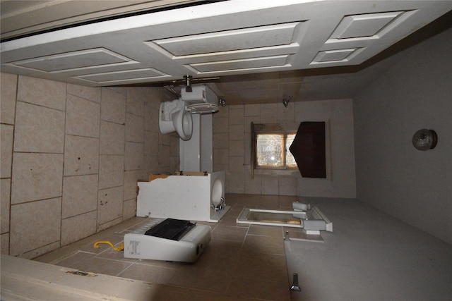 bathroom featuring tile patterned floors and a tile shower