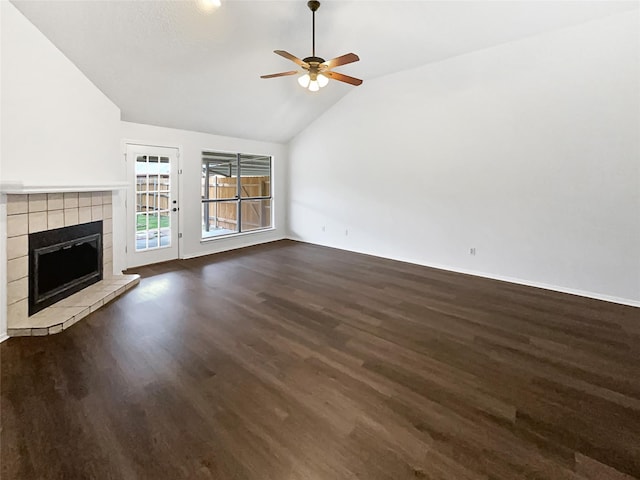 unfurnished living room featuring a tile fireplace, high vaulted ceiling, dark wood-type flooring, and a ceiling fan