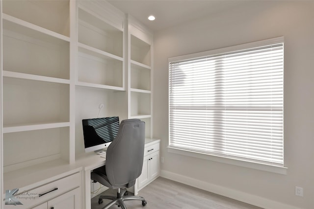 office with recessed lighting, light wood-type flooring, plenty of natural light, and baseboards