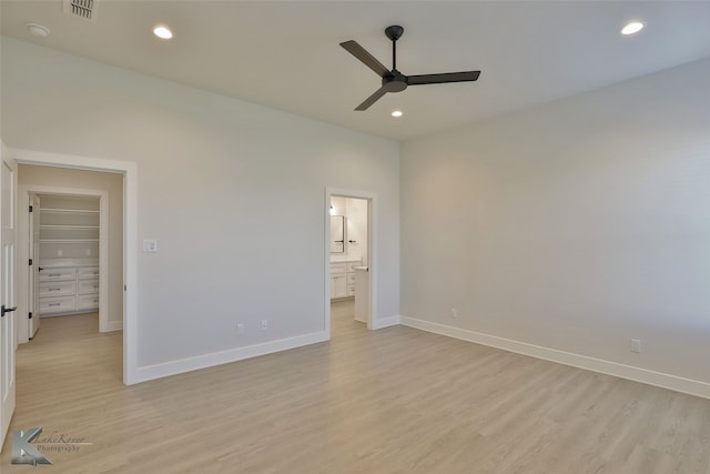 unfurnished bedroom with visible vents, baseboards, and light wood finished floors