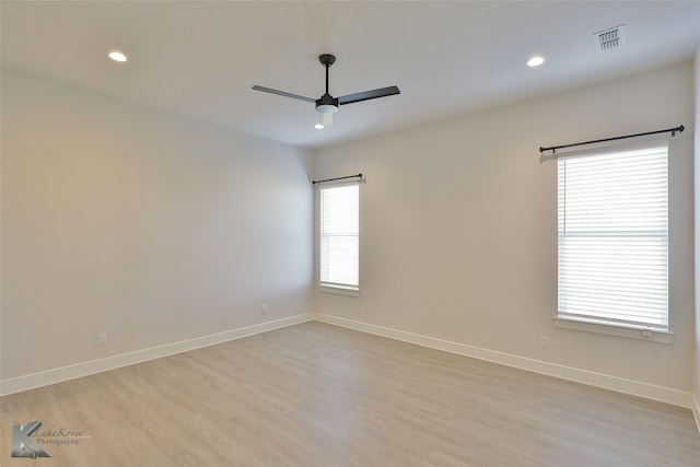 spare room with visible vents, baseboards, ceiling fan, recessed lighting, and light wood-style flooring