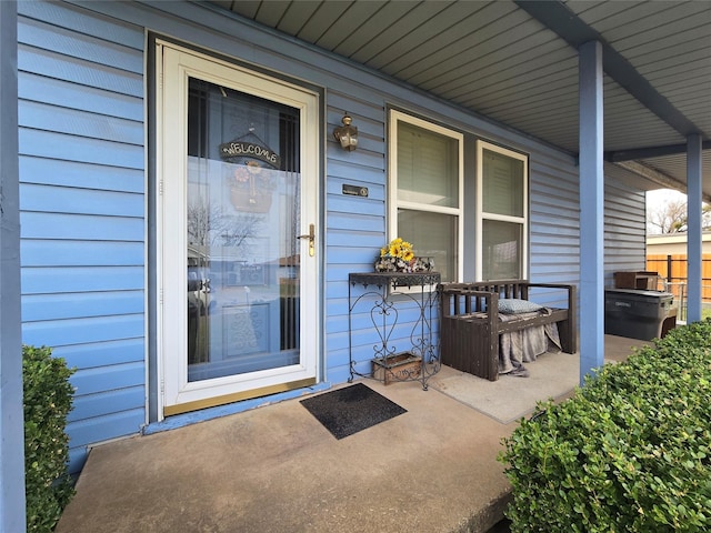 property entrance with covered porch