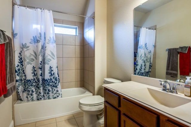 bathroom featuring tile patterned flooring, toilet, vanity, and shower / bath combo