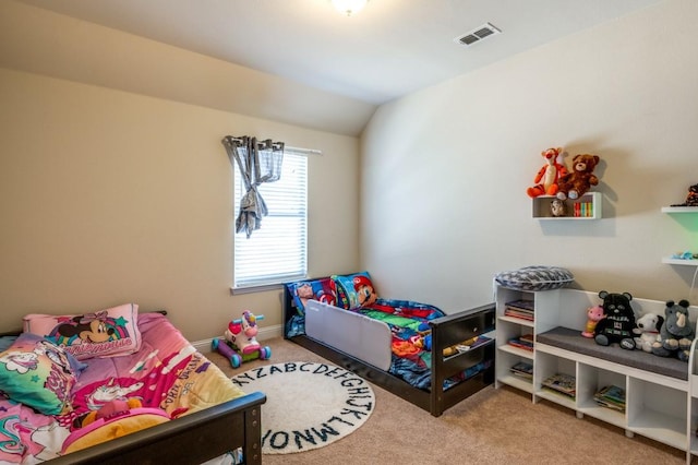 carpeted bedroom featuring visible vents, lofted ceiling, and baseboards