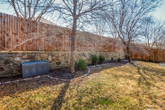 view of yard with a fenced backyard