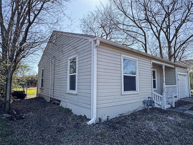 view of side of property with a garage