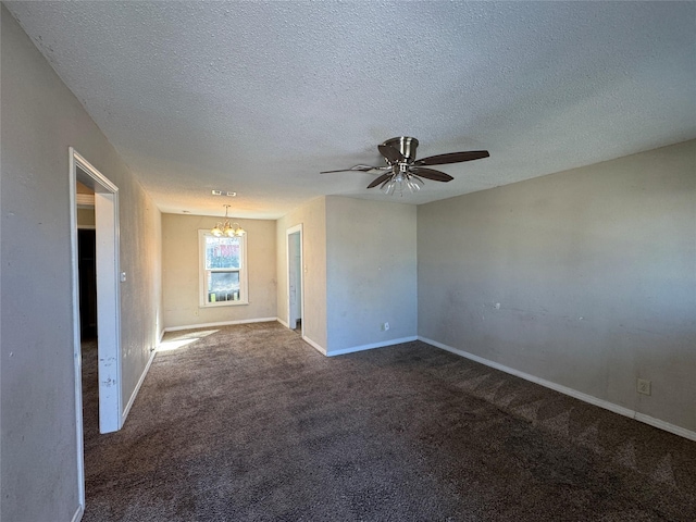 carpeted spare room with ceiling fan with notable chandelier, a textured ceiling, and baseboards