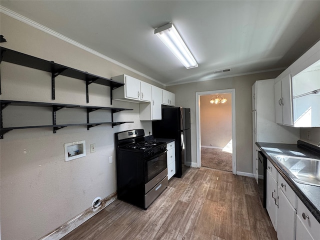 kitchen featuring wood finished floors, visible vents, open shelves, black appliances, and white cabinets