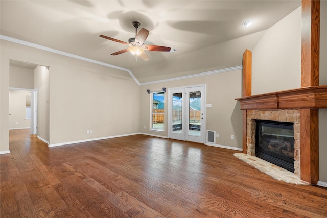 unfurnished living room with crown molding, lofted ceiling, and wood finished floors