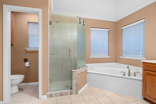 bathroom featuring vanity, a stall shower, tile patterned flooring, a garden tub, and toilet