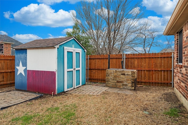 view of shed with a fenced backyard