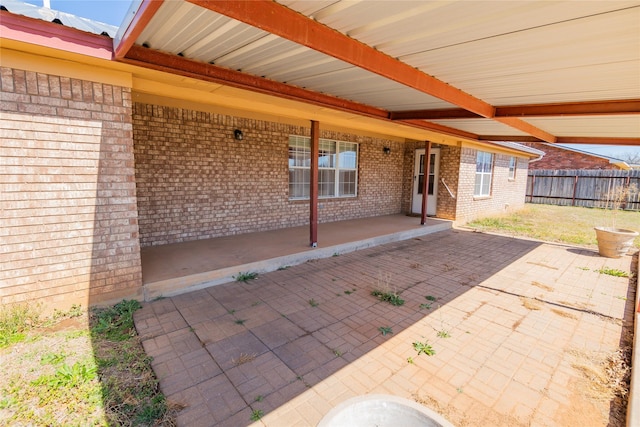 view of patio / terrace featuring fence