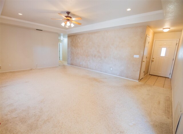 tiled spare room with recessed lighting, a raised ceiling, carpet flooring, and crown molding