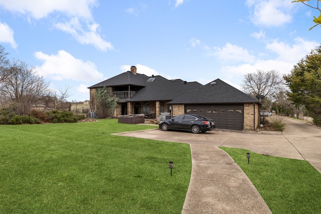 view of front of property with a balcony, concrete driveway, a front yard, a garage, and brick siding