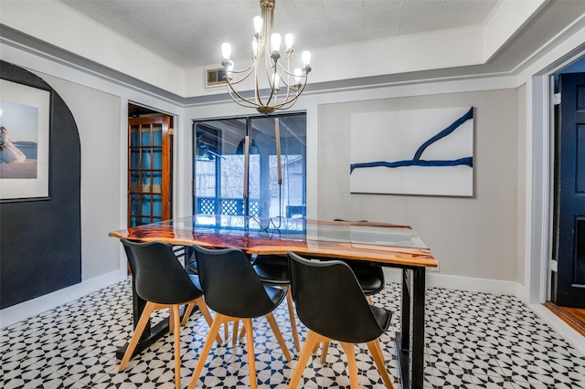 dining space featuring a raised ceiling, a notable chandelier, baseboards, and visible vents