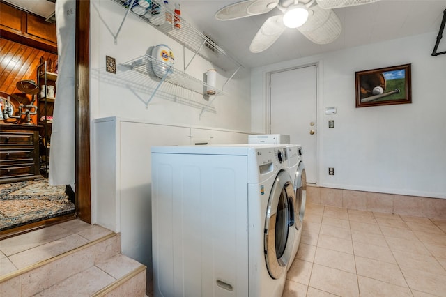 laundry room featuring tile patterned floors, separate washer and dryer, a ceiling fan, and laundry area