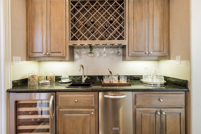 bar with a sink, wet bar, and beverage cooler