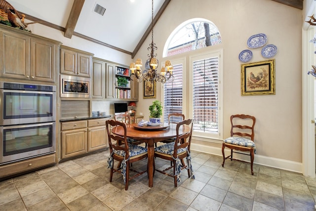 dining space featuring beam ceiling, a healthy amount of sunlight, baseboards, and a chandelier