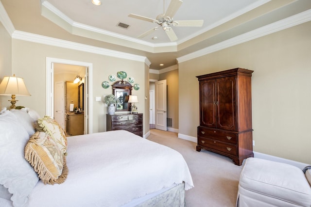 bedroom with a raised ceiling, baseboards, visible vents, and light carpet