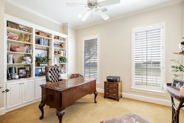 home office with baseboards, light colored carpet, ceiling fan, and crown molding