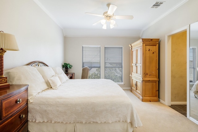 bedroom with visible vents, baseboards, carpet, and crown molding