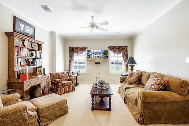 living room featuring a ceiling fan, visible vents, baseboards, crown molding, and carpet flooring