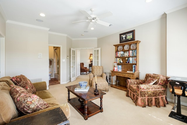 carpeted living room featuring visible vents, crown molding, baseboards, french doors, and a ceiling fan