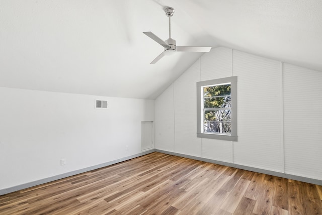 bonus room with ceiling fan, visible vents, wood finished floors, and vaulted ceiling