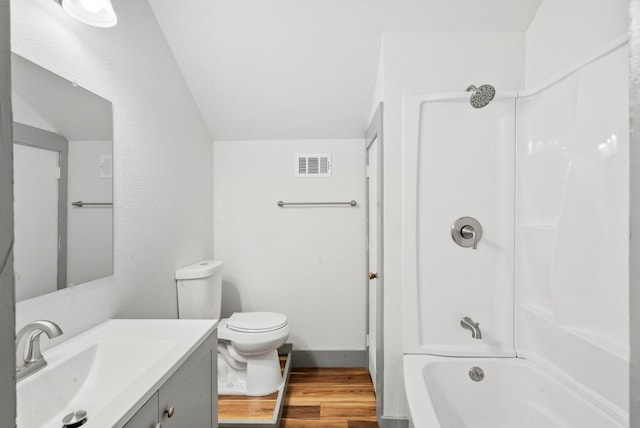 bathroom with visible vents, toilet, wood finished floors, bathtub / shower combination, and vanity