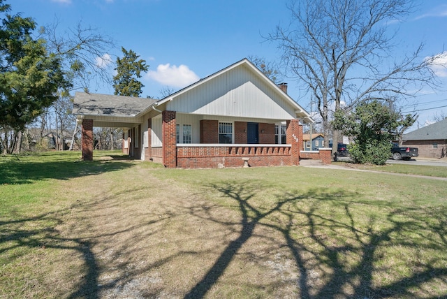 view of front of property with brick siding and a front yard