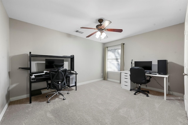 office area with visible vents, baseboards, carpet, and a ceiling fan