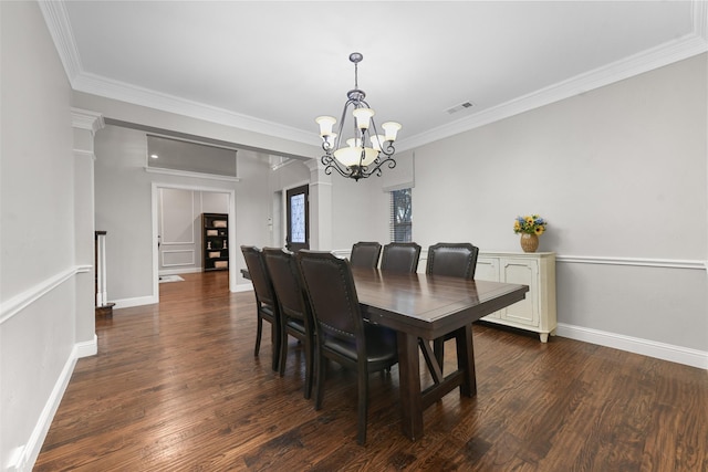 dining space with a notable chandelier, visible vents, crown molding, and dark wood-style flooring