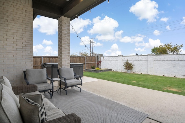 view of patio featuring a fenced backyard, an outdoor hangout area, and a hot tub