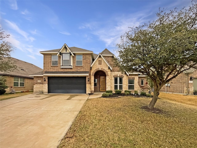 traditional-style home with brick siding, concrete driveway, and a garage