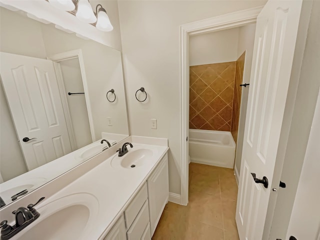 bathroom with tile patterned floors, double vanity, and a sink