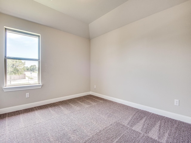 unfurnished room featuring baseboards and carpet