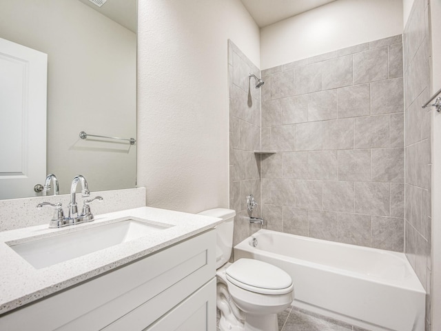 bathroom with tile patterned floors, vanity, toilet, and shower / bathtub combination