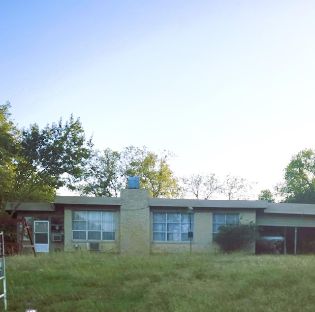 rear view of property with a chimney