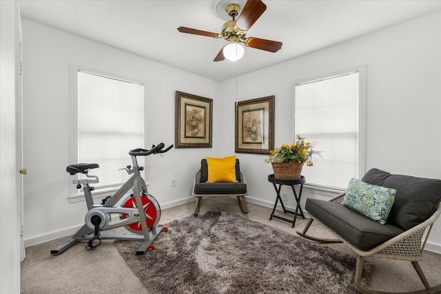 exercise room featuring a wealth of natural light, a ceiling fan, carpet flooring, and baseboards