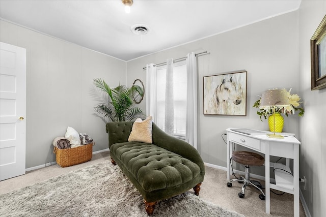 living area with carpet floors, baseboards, and visible vents